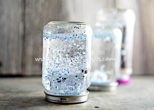 These Mason Jar Snow Globes with farm animals are fun for kids to make while learning about winter on a farm.