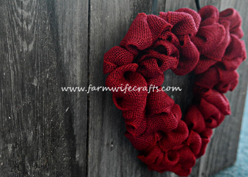 An easy to make heart burlap wreath perfect for sprucing up any door for Valentines Day.