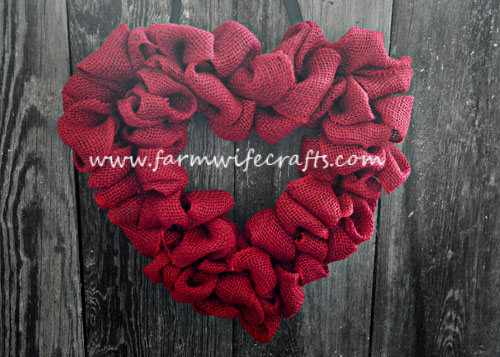 An easy to make heart burlap wreath perfect for sprucing up any door for Valentines Day.