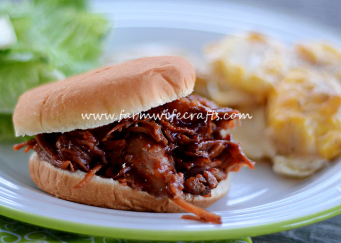 This crockpot cola BBQ pulled pork recipe is so juicy and tender. Just toss it in the crockpot and it's sure to be a crowd pleaser!