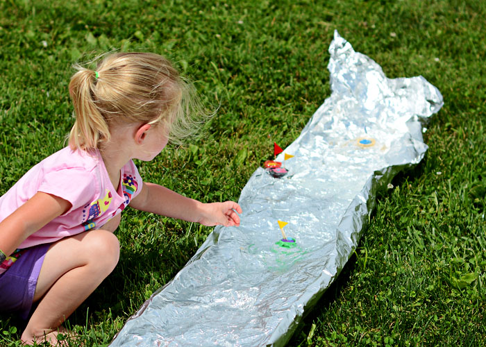 This tin foil river is an easy way to get kids outside this summer!