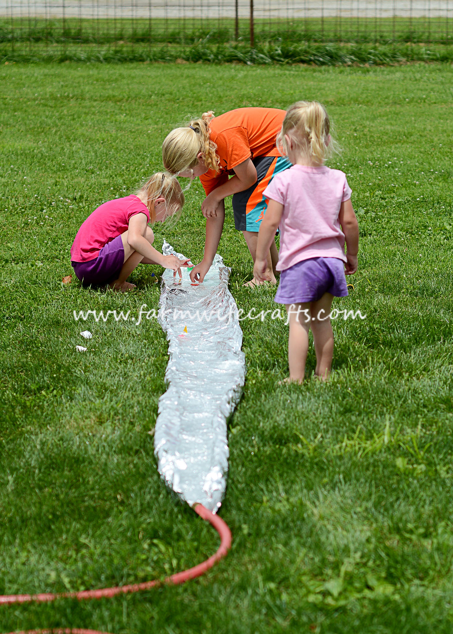 This tin foil river is an easy way to get kids outside this summer!