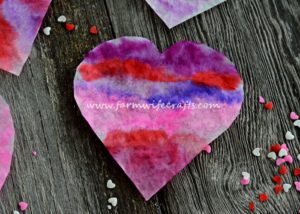 These coffee filter heart suncatchers are simple and easy to make. The bright colors look great in the window.