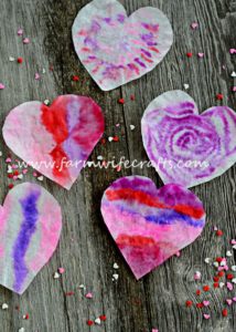 These coffee filter heart suncatchers are simple and easy to make. The bright colors look great in the window.