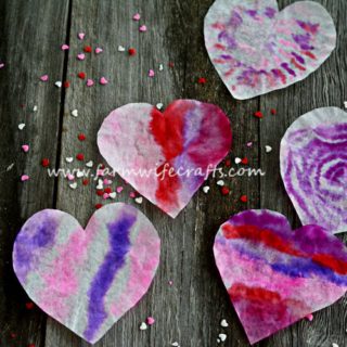 These coffee filter heart suncatchers are simple and easy to make. The bright colors look great in the window.