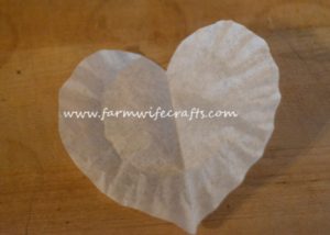 These coffee filter heart suncatchers are simple and easy to make. The bright colors look great in the window.