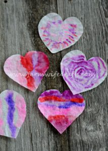 These coffee filter heart suncatchers are simple and easy to make. The bright colors look great in the window.