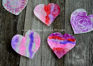 These coffee filter heart suncatchers are simple and easy to make. The bright colors look great in the window.