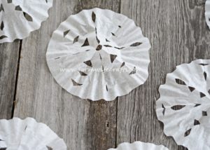 Looking for a quick, easy way to entertain the kids for a few minutes this winter? These Coffee Filter Snowflakes are the perfect cure for cabin fever!