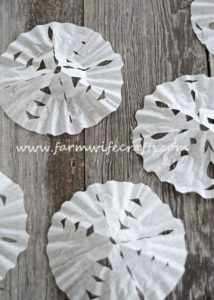 Looking for a quick, easy way to entertain the kids for a few minutes this winter? These Coffee Filter Snowflakes are the perfect cure for cabin fever!