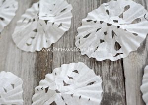 Looking for a quick, easy way to entertain the kids for a few minutes this winter? These Coffee Filter Snowflakes are the perfect cure for cabin fever!