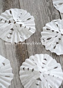 Looking for a quick, easy way to entertain the kids for a few minutes this winter? These Coffee Filter Snowflakes are the perfect cure for cabin fever!