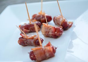 Looking for an easy and delicious appetizer for your next party? These Bacon Wrapped Smokies will be a hit and your guests will be begging for the recipe!