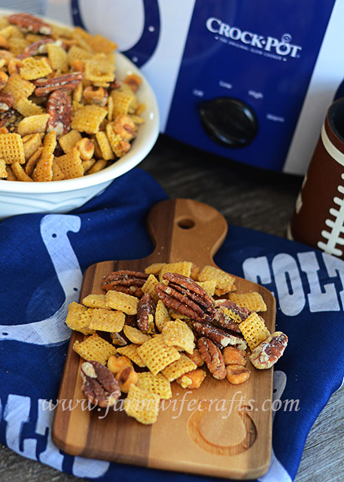 The temperatures are dropping and that can only mean one thing, harvest is almost here:)!!!  Oh wait, and football season!!!  This recipe if Crockpot Cornbread Chex-Mix is perfect for your next tailgate of football party.