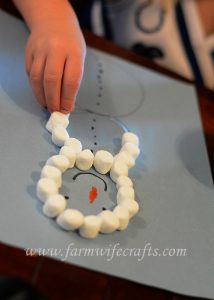 Are you looking for a simple craft to keep the kids entertained while it's too cold outside to go out and play?  This marshmallow snowman winter craft is just what you might be looking for!