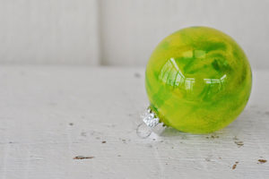 Do you have any holiday traditions?  We have a few and one of them is that the girls make a new ornament every year like these Melted Crayon Ornaments.