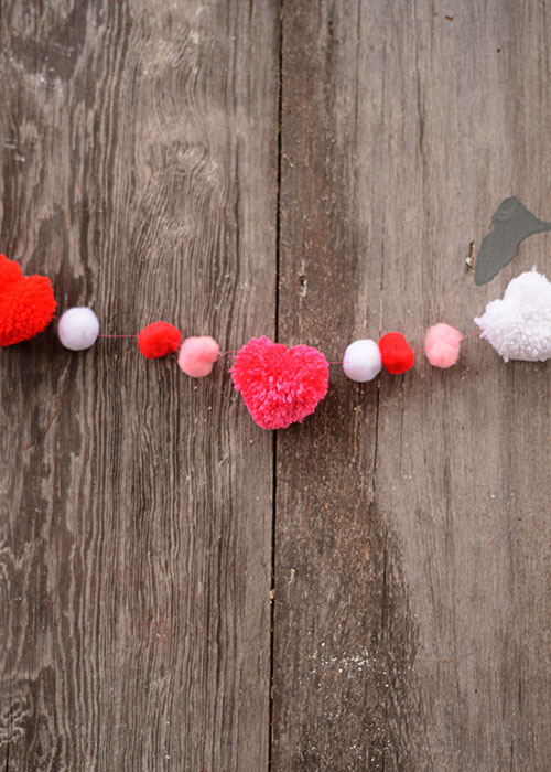 Valentine's Day is right around the corner.  I love decorating for Valentine's Day.  I don't have a lot of decorations, but what I do have, are pretty simple and the pop of color definitely brightens up the drab winter days.  This DIY Valentine's Garland is a perfect addition to our decor!