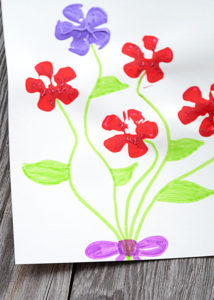 It's almost Spring!!!!!!  If you're ready for bright colors and flowers then have your kids make these easy-to-make, adorable Pop Bottle Flower Paintings.