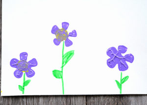 It's almost Spring!!!!!!  If you're ready for bright colors and flowers then have your kids make these easy-to-make, adorable Pop Bottle Flower Paintings.