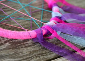 Do you have a little girl that is crazy about unicorns like mine?  This DIY Unicorn Dreamcatcher is easy to make and is sure to put a smile on her face!