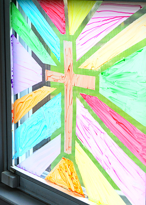 Looking for a fun, easy craft that may make your kids think you've lost your mind?  This Stained Glass Window Painting might be what you need in your life!