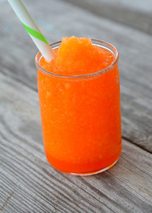 It's heating up this Summer and your kiddos will love this fun treat!  No need to head to the gas station because you can make and even better slushie right at home.  This 3 Ingredient Kool-Aid Slushie will be your kid's new favorite Summer treat!