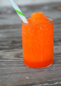 It's heating up this Summer and your kiddos will love this fun treat!  No need to head to the gas station because you can make and even better slushie right at home.  This 3 Ingredient Kool-Aid Slushie will be your kid's new favorite Summer treat!