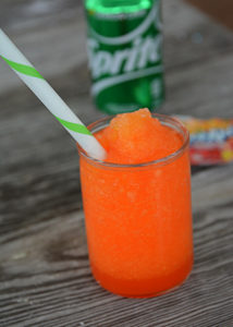 It's heating up this Summer and your kiddos will love this fun treat!  No need to head to the gas station because you can make and even better slushie right at home.  This 3 Ingredient Kool-Aid Slushie will be your kid's new favorite Summer treat!