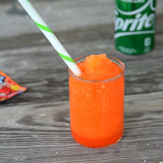 It's heating up this Summer and your kiddos will love this fun treat!  No need to head to the gas station because you can make and even better slushie right at home.  This 3 Ingredient Kool-Aid Slushie will be your kid's new favorite Summer treat!