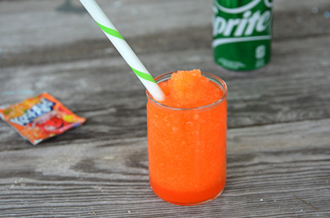 It's heating up this Summer and your kiddos will love this fun treat! No need to head to the gas station because you can make and even better slushie right at home. This 3 Ingredient Kool-Aid Slushie will be your kid's new favorite Summer treat!