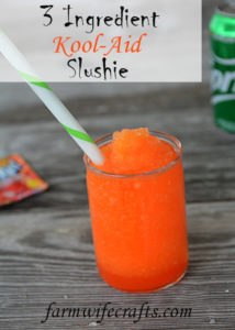 It's heating up this Summer and your kiddos will love this fun treat!  No need to head to the gas station because you can make and even better slushie right at home.  This 3 Ingredient Kool-Aid Slushie will be your kid's new favorite Summer treat!