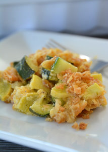 That zucchini in your garden will be ready before you know it.  One zucchini plant seems to produce about 1,459 zucchinis, so, if you're like me, you're probably looking for more recipes to use up all that zucchini and yellow squash!  This recipe for cheesy yellow squash and zucchini casserole is definitely a new family favorite!