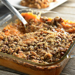 Trying to figure out what to take to that holiday pitch-in?  This Sweet Potato Casserole is a favorite at our holiday get-togethers