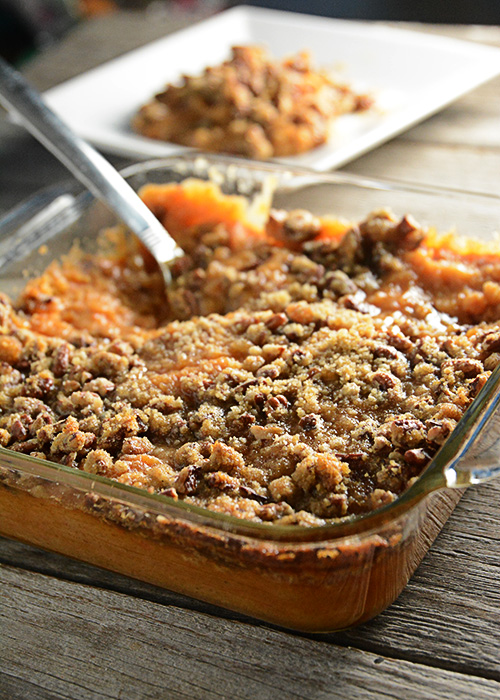 Trying to figure out what to take to that holiday pitch-in?  This Sweet Potato Casserole is a favorite at our holiday get-togethers