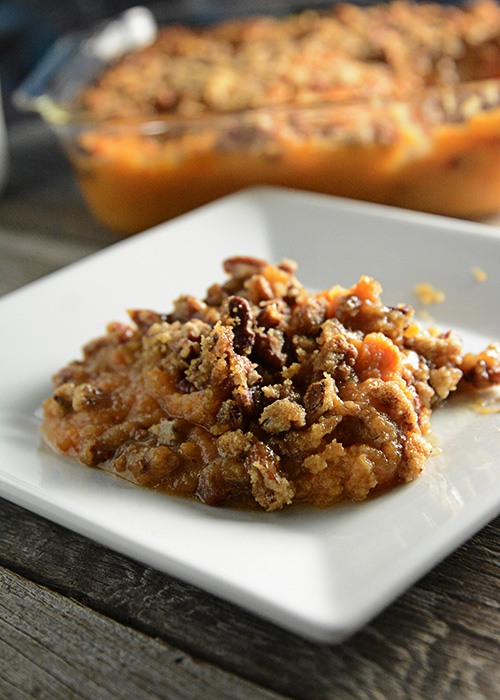 Trying to figure out what to take to that holiday pitch-in?  This Sweet Potato Casserole is a favorite at our holiday get-togethers