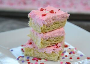 Do you love iced sugar cookies?  Then you need to try these Fluffy Sugar Cookie Bars.  Easy to whip up and with just the right amount of almond flavor they are delicious!