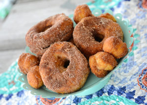 Who loves donuts?  Who doesn't have a donut shop within a 15 mile radius of their house?  Both of those questions apply at our house, so when I discovered you could make donuts in your air fryer, I couldn't wait to make them!  These Easy to Make Air Fryer Donuts will be a hit in your house!