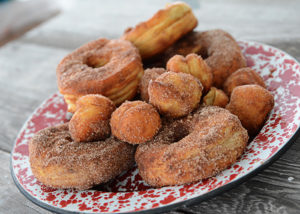 Who loves donuts?  Who doesn't have a donut shop within a 15 mile radius of their house?  Both of those questions apply at our house, so when I discovered you could make donuts in your air fryer, I couldn't wait to make them!  These Easy to Make Air Fryer Donuts will be a hit in your house!