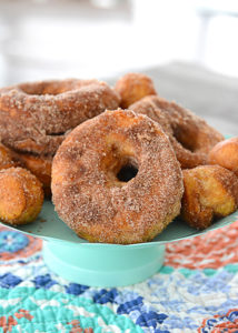Who loves donuts?  Who doesn't have a donut shop within a 15 mile radius of their house?  Both of those questions apply at our house, so when I discovered you could make donuts in your air fryer, I couldn't wait to make them!  These Easy to Make Air Fryer Donuts will be a hit in your house!