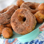 Who loves donuts?  Who doesn't have a donut shop within a 15 mile radius of their house?  Both of those questions apply at our house, so when I discovered you could make donuts in your air fryer, I couldn't wait to make them!  These Easy to Make Air Fryer Donuts will be a hit in your house!