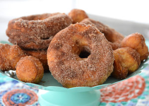 Who loves donuts?  Who doesn't have a donut shop within a 15 mile radius of their house?  Both of those questions apply at our house, so when I discovered you could make donuts in your air fryer, I couldn't wait to make them!  These Easy to Make Air Fryer Donuts will be a hit in your house!